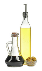 Salad dressings and olives isolated on white