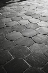 Geometric stone tiles paving pattern on floor with lighting contrast