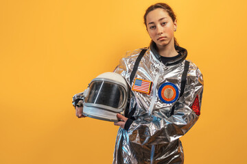 Strong female astronaut flexing muscles, confident, powerful.