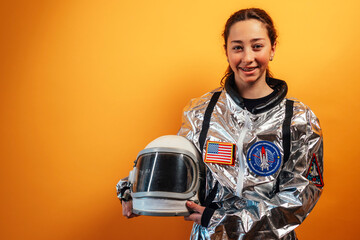 Strong female astronaut flexing muscles, confident, powerful.