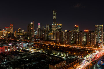 Obraz premium The urban atmosphere of landmark buildings at night in Beijing, China