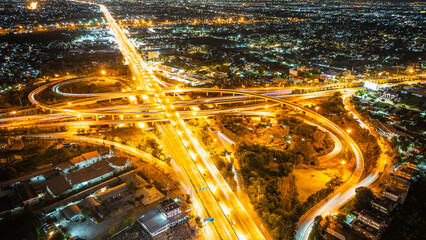Expressway top view, Road traffic an important infrastructure, Drone aerial view fly in circle, traffic transportation, Public transport or commuter city life concept of economic and energ, transport.
