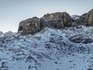 Italian Dolomites drone aerial view in winter snow ski sunny days. Sella Ronda Marmolada .Aerial landscape of snowy Italian Alps Dolomites with Sella group in front and Marmolada. Sella Ronda group.