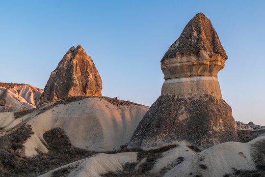 Cappadocia rock formations at sunset - Powered by Adobe