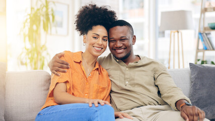Fototapeta premium Portrait, love and happy couple hug, relax and bonding together on living room sofa with care, support and trust. Happiness, home and black man, woman or marriage people romance, smile and embrace