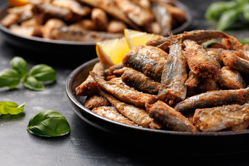 Crispy fried sardines with herbs and lemon. Healthy mediterranean food