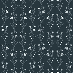 Fototapeta premium Seamless pattern featuring delicate spring snowdrop flowers on a dark background