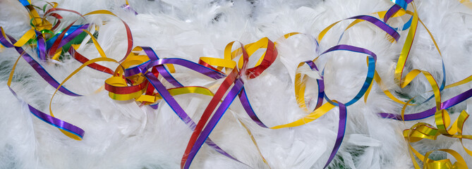 Colorful streamers on white feathers