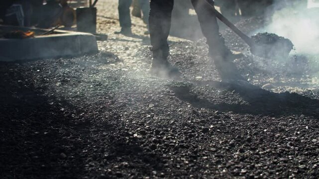 Hot Asphalt Paving on Road Construction Site