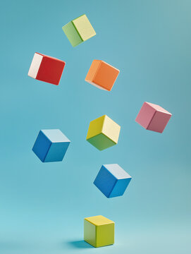 Fototapeta Floating Colorful Cubes in Minimalist Blue Background
