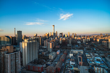 A panoramic view from a high altitude in the city of Beijing, China, showcases numerous tall buildings © 文普 王