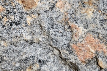 Fototapeta premium A close-up view of a rock with a visible crack, suitable for use in science and nature illustrations