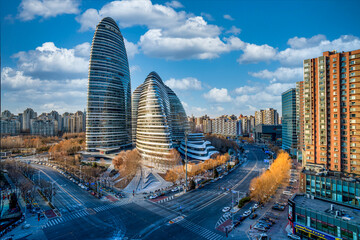 The scene of modern architecture of Wangjing SOHO in China and the street traffic