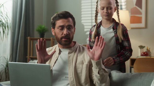 Caucasian man male freelancer business work distant businessman at home couch father working business laptop using computer busy angry little girl daughter child kid yell attention bad behavior family
