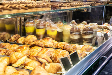 Display case showing various pastries and desserts in Naples, Italy