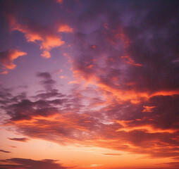 The sky displays a stunning blend of deep orange, soft pink, and rich