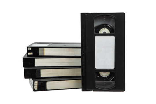 A stack of vintage VHS video tapes with blank labels, isolated on a white background, showcasing retro technology for recording and watching movies at home.