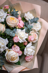 A Stunning Arrangement Featuring a Beautiful Bouquet of Pink and White Roses Alongside Lilies