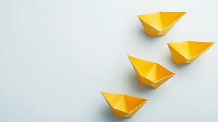 A yellow paper boat drifting away from the others on a light background symbolizing individuality Flat lay with space for text