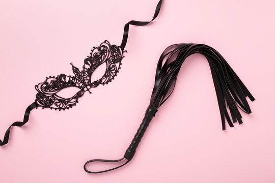 Set of erotic BDSM accessories on color background, top view
