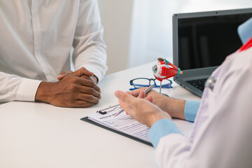 ophthalmologist is examining the patient's eye abnormalities to correct them so that they can see...
