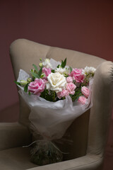 A Stunning Arrangement Featuring a Beautiful Bouquet of Pink and White Roses Alongside Lilies