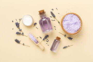 Lavender spa cosmetic on color background, top view