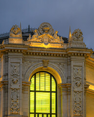 Illuminated arched window of the heritage building Bank of Spain, Madrid, Spain