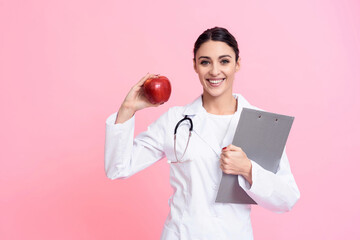 Doctor sitting at desk in office.