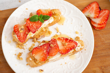 Strawberry and cottage cheese sandwich on white table