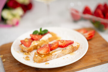 Strawberry and cottage cheese sandwich on white table
