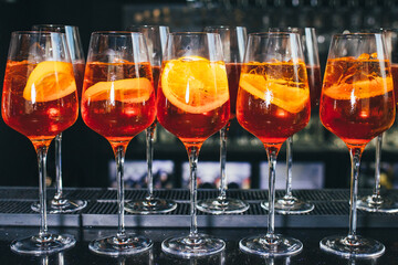Refreshing Aperol Spritz cocktail in elegant glasses filled with ice and an orange slice