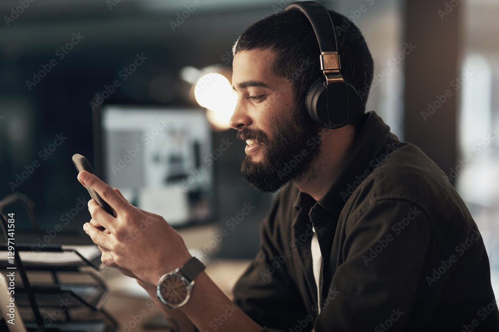 Poster creative, man and smile with smartphone, typing and video editor at night with headphones for projec