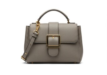 A stylish grey leather handbag with a golden buckle and detachable strap isolated on a white background