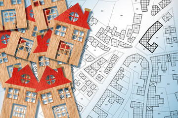 HOMEOWNER ASSOCIATION CONCEPT with group of colored house models, imaginary General Urban Plan and cadastral map with copy space