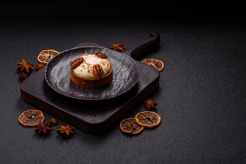 Sweet round tart with white citrus cream and pecans