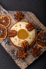 Sweet round tart with white citrus cream and pecans