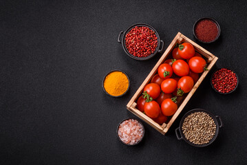 Ripe red cherry tomatoes in a wooden box