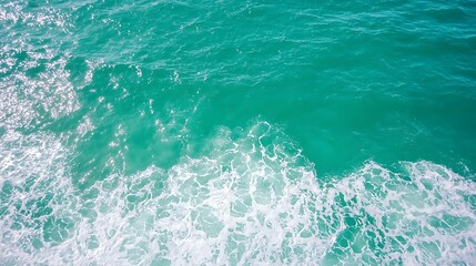 Fototapeta premium Tranquil Ocean Waves Lapping Gently on a Sunny Day with Sparkling Water Surface
