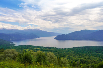 Fototapeta premium Desktop Screensaver, Breathtaking panoramic view of mountain lake under cloudy sky