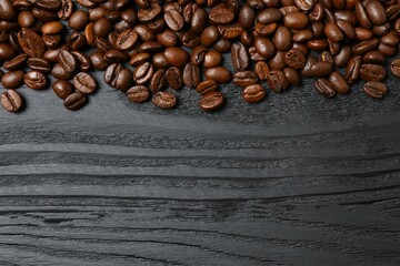 Fresh coffee beans on wooden background
