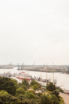 Cityscape of buildings, trees and harbor. Hamburg, Germany