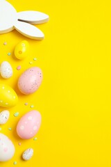 Happy Easter. Colorful eggs and  white bunny ears on pink background, space for text or advertising
