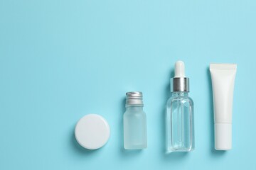 Natural cosmetic products a blue background, top view