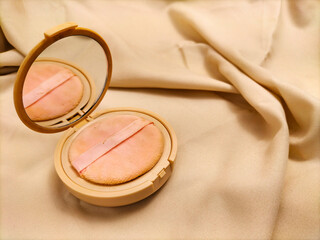 make up powder on fabric background