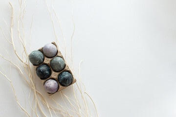 Painted eggs cooked for Easter are in an eco-friendly tray