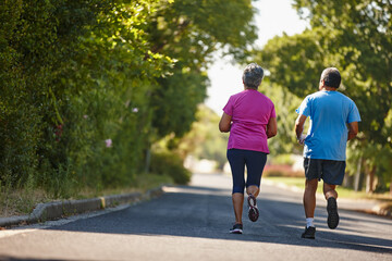 Fototapeta premium Running, park and back of senior couple for exercise, training and cardio workout together. Retirement, marriage and mature man with woman for fitness and outdoors for wellness, health and mobility