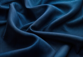 Fototapeta premium Elegant Dark Blue Fabric with Soft Folds and Smooth Texture