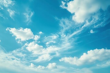 Obraz premium Soft Pale Blue Sky with Fluffy White Clouds - Serene Abstract Background for Tranquil Spaces