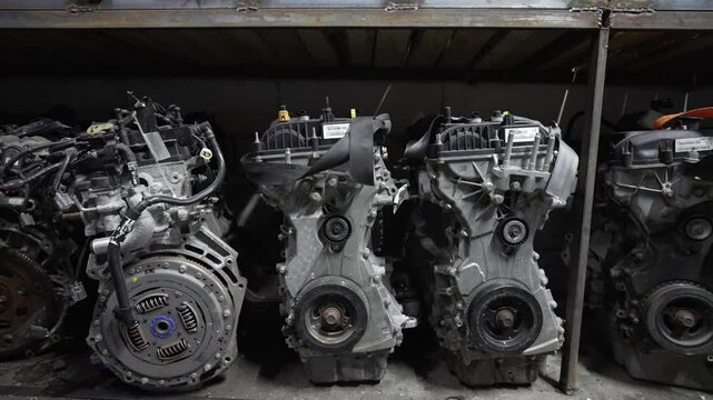 Used car engines stored in a junkyard. Car spare parts concept.